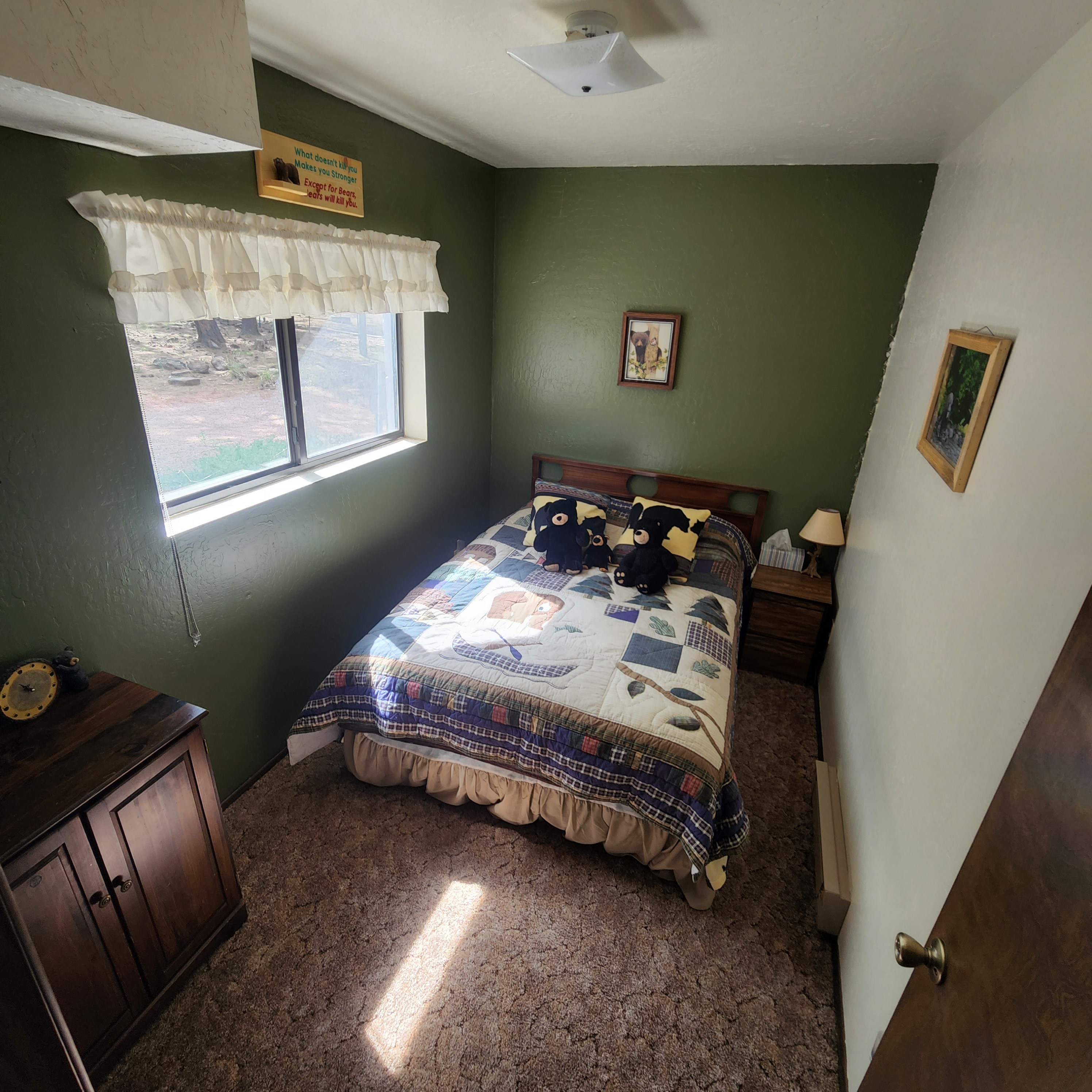 Bear Room - The "Bear" bedroom is fully themed with bear decor and has a double bed and a great view of the back yard from the window.