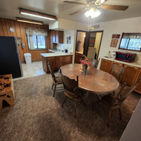 The dining room is set right off the kitchen with direct access to the bathroom, utility room and back yard areas.